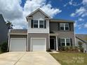 Attractive two-story home with a two-car garage, nice landscaping and a well-manicured lawn at 165 Clove Hitch Dr # I281, Statesville, NC 28677
