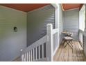 Relaxing condo balcony featuring wood floors and cozy seating at 2502 Cranbrook Ln # 8, Charlotte, NC 28207