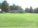 Well maintained single story home featuring a large lawn and traditional facade at 3942 Benny Shrum Ln, Maiden, NC 28650