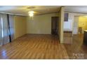 Cozy living room featuring wood-look floors and plenty of natural light at 3942 Benny Shrum Ln, Maiden, NC 28650