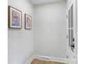 Entry hallway featuring neutral colors, modern art, and a bright, welcoming atmosphere at 4042 Uppergate Ln, Charlotte, NC 28215