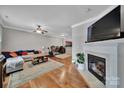 Spacious living room with a fireplace, hardwood floors, and open layout at 413 Hurston Cir, Charlotte, NC 28208