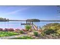 A private dock extends into the serene lake, complete with a gazebo for relaxing waterfront moments at 495 Bay Harbour Rd, Mooresville, NC 28117