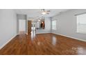 Open-concept living room featuring gleaming hardwood floors and tons of natural light at 5076 Newport Lakes Dr, Rock Hill, SC 29732