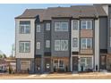 New construction townhome featuring a mix of brick and siding with a modern design at 5512 Swaling St, Charlotte, NC 28217