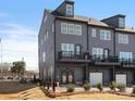 Modern townhome boasts a private balcony and convenient garage access at 5524 Swaling St, Charlotte, NC 28217