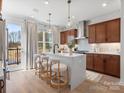 Stunning kitchen features a large island, pendant lighting, and stainless steel appliances at 5524 Swaling St, Charlotte, NC 28217