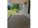 Inviting front porch with brick trim, leading to the front door of the home at 6006 White Store Rd, Marshville, NC 28103
