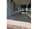 Inviting front porch with brick trim, leading to the front door of the home at 6006 White Store Rd, Marshville, NC 28103