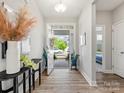 Inviting foyer with stylish decor, hardwood floors, and a view of the outdoors at 6012 Millbridge Pkwy, Waxhaw, NC 28173