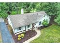 Aerial shot of a well-maintained home, showcasing its roof, landscaping, and driveway at 6624 Lancer Dr, Charlotte, NC 28226