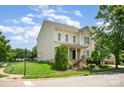 Inviting two-story home with well-maintained lawn, mature trees, and classic architectural design at 6948 Church Wood Ln, Huntersville, NC 28078