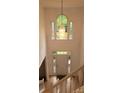 Elegant foyer with soaring ceilings, chandelier, and hardwood floors creating a grand entrance at 12314 Chickasaw Dr, Huntersville, NC 28078