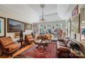 Elegant living room with hardwood floors, a coffered ceiling, and ornate decor at 1337 Braeburn Nw Rd, Concord, NC 28027