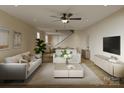 Bright, open living room featuring neutral decor, hardwood floors, and a modern ceiling fan at 2432 Arty Ave, Charlotte, NC 28208
