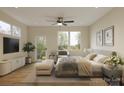 Serene main bedroom with ample natural light, wood floors, and a door to the outside at 2432 Arty Ave, Charlotte, NC 28208