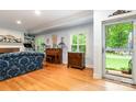 Bright living room with hardwood floors, built-in shelving, and large windows at 408 Idlewood Dr, Kannapolis, NC 28083