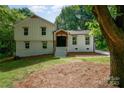 A welcoming two-story home features a painted brick foundation and well-maintained yard at 437 Chadmore South Dr, Charlotte, NC 28270
