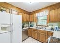 A kitchen featuring stainless steel appliances, wood cabinets, and a large window at 4424 Huntington Dr, Gastonia, NC 28056