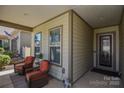 Inviting front porch featuring comfortable seating and a welcoming entryway at 464 Granite Lake Ct, Denver, NC 28037