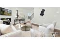 Inviting living room with fireplace, neutral décor, and plenty of natural light at 5540 Pamplona Way, Charlotte, NC 28214