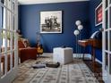 Inviting home office with dark blue accent wall, decorated with music-inspired decor at 6013 Pivot Ct, Charlotte, NC 28205