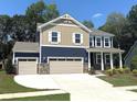 Beautiful two-story home with a three-car garage, complemented by lush landscaping at 9945 Cask Way, Huntersville, NC 28078