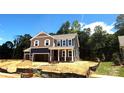 Charming two-story home with a two-car garage and inviting front porch at 9945 Cask Way, Huntersville, NC 28078