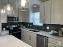 A well-lit kitchen featuring stainless steel appliances and modern cabinetry at 1004 Johnson St, Charlotte, NC 28206