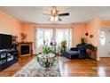 Cozy living room with a fireplace, bay windows, and comfortable seating, creating a relaxing atmosphere at 109 Ashley St, Shelby, NC 28150
