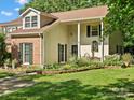 Exterior view of a well-maintained home with manicured landscaping and inviting curb appeal at 11121 Sevilla Ct, Charlotte, NC 28226