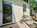 Close-up of front porch featuring a decorative bench and charming details at 11121 Sevilla Ct, Charlotte, NC 28226