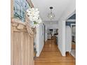 Bright entryway with hardwood floors, paneled walls, and a view through the home to living spaces at 1200 Rutledge Ave, Charlotte, NC 28211