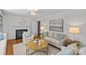 Cozy living room with a fireplace, comfortable seating, and tasteful decor creating an inviting atmosphere at 1200 Rutledge Ave, Charlotte, NC 28211