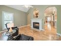 Inviting living area features a fireplace, hardwood floors and elegant architectural details at 12039 Lawings Corner Dr, Huntersville, NC 28078