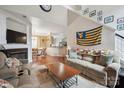 Cozy living room featuring a fireplace, open layout and high ceilings at 16337 Greybriar Forest Ln, Charlotte, NC 28278