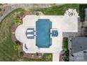 A bird's eye view of the gorgeous pool and patio area that also features a fire pit and lounge chairs at 18207 Shearer Rd, Davidson, NC 28036