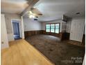 Bright living room with hardwood and carpeted floors, adjacent to kitchen and features multiple windows at 269 Saddle Rd, Lancaster, SC 29720