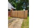 Backyard view with newly installed wooden fence, offering privacy and security at 2939 Lasalle St, Charlotte, NC 28216