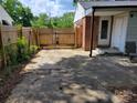Gated backyard featuring a private entrance and durable concrete flooring at 2939 Lasalle St, Charlotte, NC 28216