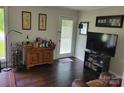 Cozy living room with a wooden bar cabinet, perfect for entertaining guests and unwinding at 2939 Lasalle St, Charlotte, NC 28216