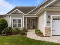 A close-up of the front door of a charming single-Gathering home with a sidewalk leading to the entrance at 301 Garner Dr, Salisbury, NC 28146