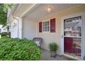 Welcoming front porch featuring a comfortable seating area and lush greenery, creating a cozy entrance at 3050 Des Prez Ave, Fort Mill, SC 29707