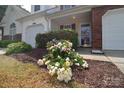 Inviting home exterior with well-manicured shrubbery and flowering bushes, adding a touch of natural beauty at 3050 Des Prez Ave, Fort Mill, SC 29707