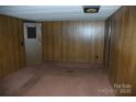 Bedroom featuring paneled walls and neutral carpet at 3225 Sawmill Rd, Hickory Grove, SC 29717