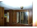 Cozy living room with wood-look floors and sliding glass doors at 3225 Sawmill Rd, Hickory Grove, SC 29717
