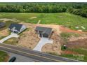 Aerial view of a house showcasing the roof, driveway and surrounding land at 355 Northbrook Iii School Rd # 10, Vale, NC 28164