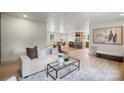Spacious living area open to the kitchen featuring hardwood floors and modern decor at 3937 Tamerlane Dr, Charlotte, NC 28205
