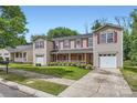 Exterior showcasing manicured lawn and private drive at 6335 Ziegler Ln, Charlotte, NC 28269