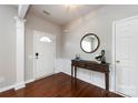 Warm and inviting foyer with hardwood floors, elegant wainscoting, and a stylish console table at 8040 Flanders St, Charlotte, NC 28277